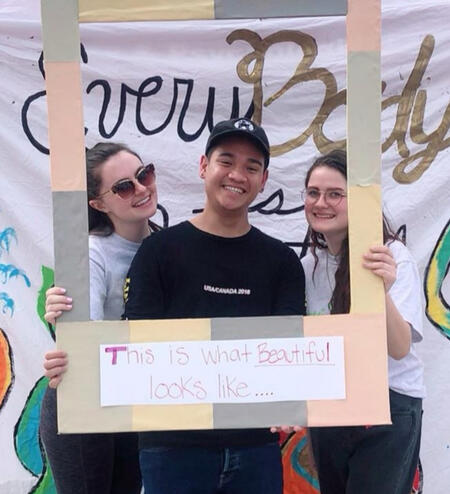 Three AM members at Your Body is Beautiful outreach.